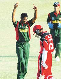 Manjural Islam celebrates after claiming the final wicket of Canada�s Austin Codrington