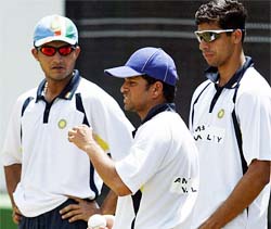 India�s captain Saurav Ganguly , Sachin Tendulkar and Ashish Nehra interact during a training session 