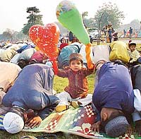 Devotees pray on the occasion of Id-ul-Zuha at the Sector 20 Mosque 
