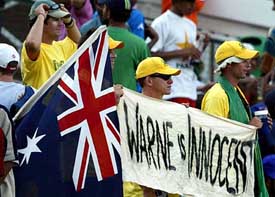 Australian fans display a banner supporting Australian bowler Shane Warne