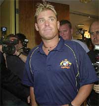 Shane Warne of Australia leaves his Press conference 