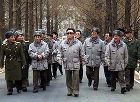 North Korean leader Kim Jong-il walks with military officials 
