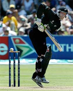 The ball passes close to the stumps as New Zealand's Chris Harris bats during their match against West Indies