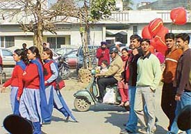 A group of boys chase schoolgirls on Valentine�s Day