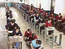 Students of class VIII take examination