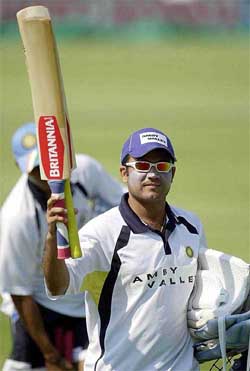 India's Virender Sehwag raises his bat