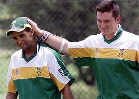 South African batsman Graeme Smith shares a joke with team mate Robin Peterson