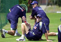 Australia's Michael Bevan stretches his body during a practice session 