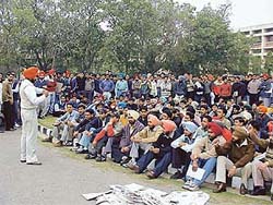 Students of Punjab Agricultural University hold a rally in protest