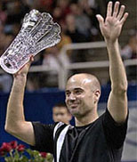 Top-seeded Andre Agassi holds his trophy