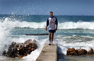 England batsman Michael Vaughan walks along the sea front in Port Elizabeth