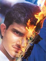A large poster of Indian cricket captain Saurav Ganguly is set ablaze