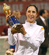Russia's Anastasia Myskina holds her trophy after winning the WTA Qatar Women's Open 