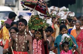 Sri Lanka's Hindu devotees walk down a street in Colombo 