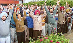 Members of the Markfed Employees Joint Action Committee protest in support of their demands 