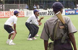 Indian cricketers practice amidst tight security 