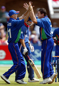 Namibia's Bjorn Kotze and Rudi Van Vuuren celebrate the wicket of England's Michael Vaughan