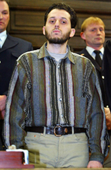 Mounir El Motassadeq of Morocco stands in a Hamburg court room