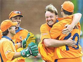 Holland�s Timotheus De Leede celebrates taking the wicket of Australia�s Jimmy Maher