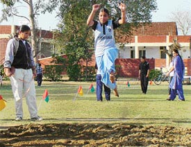 A Khalsa College for Women athlete participates in long jump event during their annual athletic meet
