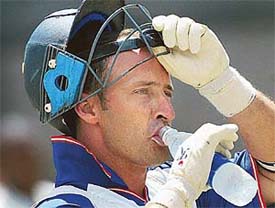 England�s skipper Nasser Hussain takes a drink of water during a practice session