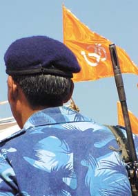A jawan of the Rapid Action Force of the CRPF keeps vigil at the venue of Vishwa Hindu Parishad Dharam Sansad at the Ramlila Ground in the Capital