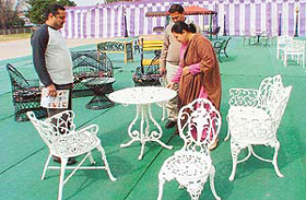 Visitors appreciate wrought-iron furniture at an exhibition organised at Parade Ground in Chandigarh on Sunday.