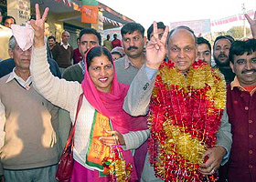 Himachal Pradesh Chief Minister Prem Kumar Dhumal shows the victory sign