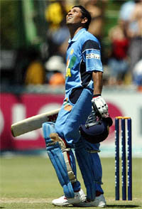 India's Sachin Tendulkar looks skywards after completing his century