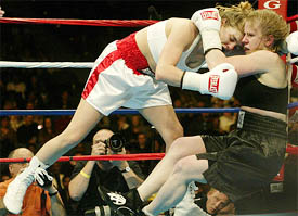 Tonya Harding and Samantha Browning fall to the mat during their bout 