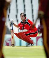Canadian batsman John Davison stops to take a break after scoring his maiden century