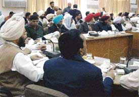 Mr Lal Singh, Finance Minister, attending a meeting of the District Planning Board