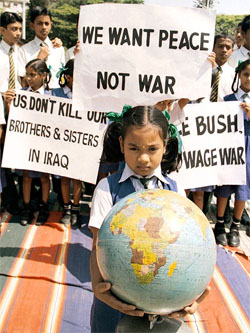 A schoolgirl holds a globe during a demonstration