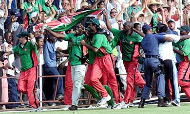 Kenyan cricketers celebrate their victory over Sri Lanka