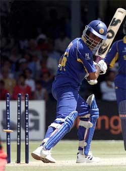 Sri Lankan batsman Hashan Tillekaratne is bowled by Kenya's Thomas Odoyo