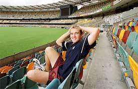 Australian bowler Nathan Hauritz poses in the stands of the Brisbane Cricket Ground 