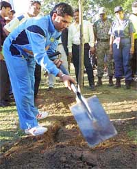 According to the traditions of the Pietermaritzburg cricket stadium, India's star batsman Sachin Tendulkar plants a tree after scoring a century 
