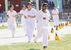 Students of Malwa College of Education take part in an athletics event