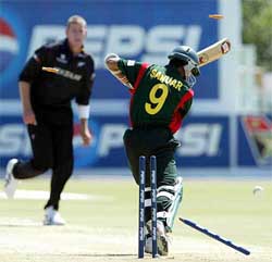 Bangladesh's Sanwar Hossain is clean bowled by New Zealand's Jacob Oram