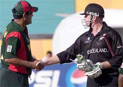 New Zealand's Scott Styris shakes hands with Bangladesh's Akram Khan