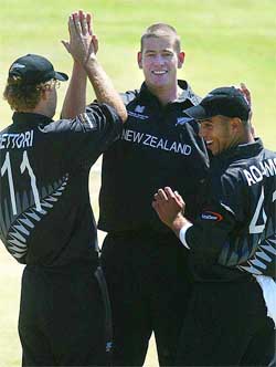 New Zealand's Jacob Oram celebrates with teammates the after dismissing Bangladesh's Sanuar