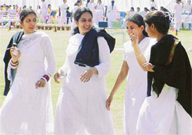 Girls take off their sweaters as a result of sudden change in temperature