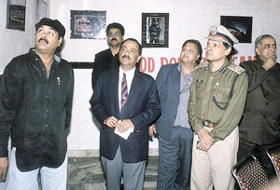 Joint Commissioner of Police Ranjeet Narain and DCP Arvind Deep view Kamal Sharma�s photo exhibition.
