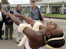 Dutch cricketers Nick Statham and Bas Zuiderent watch traditional dancers 