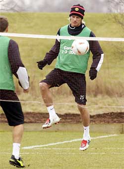 Manchester United's David Beckham plays volleyball during a training session 