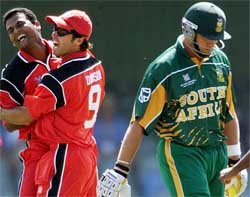 Canada's Ashish Patel celebrates with team mate John Davison after taking the wicket of South Africa's Jacques Kallis