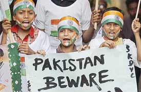 Young Indian cricket fans celebrate their team's victory over England 