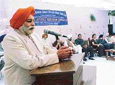 Mr Tej Parkash Singh, Transport Minister, addresses the audience