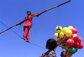 A girl walks on a rope during the Festival of Gardens in Chandigarh on Friday.