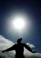 Australia's Brett Lee bowls during an invitation session with  media persons 